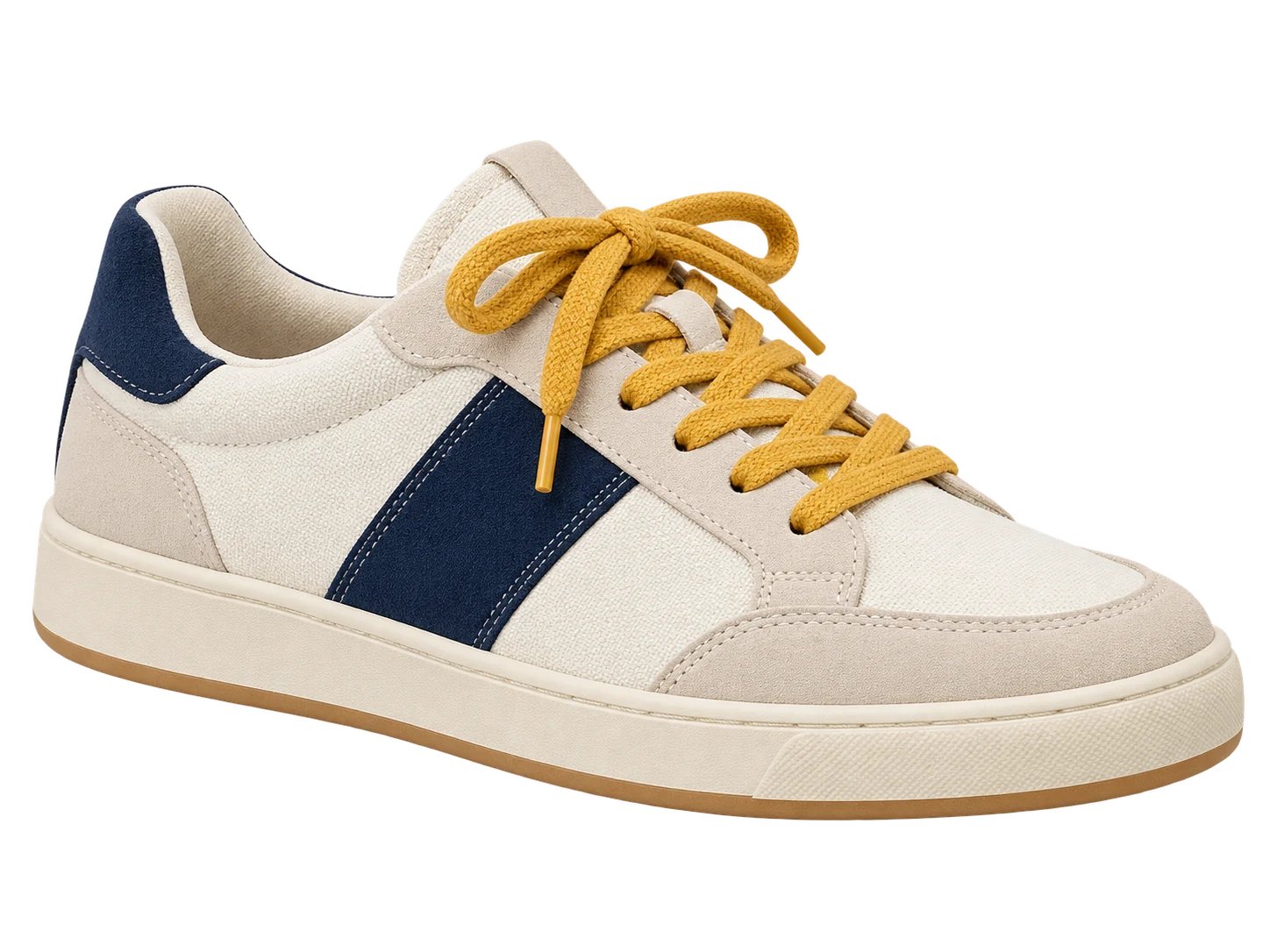 Tenis color crema y azul marino con cordones amarillos sobre un fondo rosa clásico